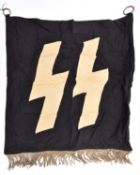 A Third Reich SS trumpet banner, 26" x 24", white runes on black background, silver alloy fringe. GC