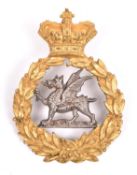 A senior NCOs forage cap badge of the South Wales Borders, 1881-98, gilt with silver dragon, tip