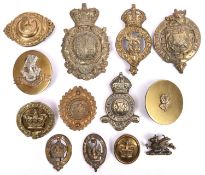 A small quantity of harness and carriage mounts, including a large brass item with Royal Arms and
