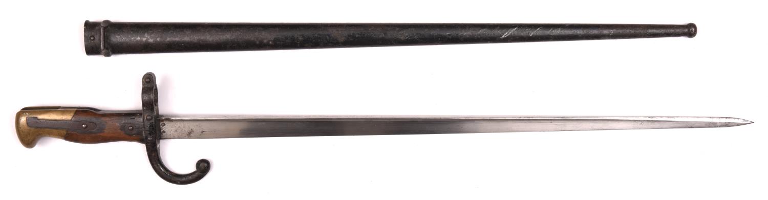 A French 1874 pattern Gras bayonet, the blade dated St Etienne 1877, in its scabbard. Generally