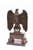 An extremely scarce and important Third Reich bronze being an eagle with a wreathed swastika in