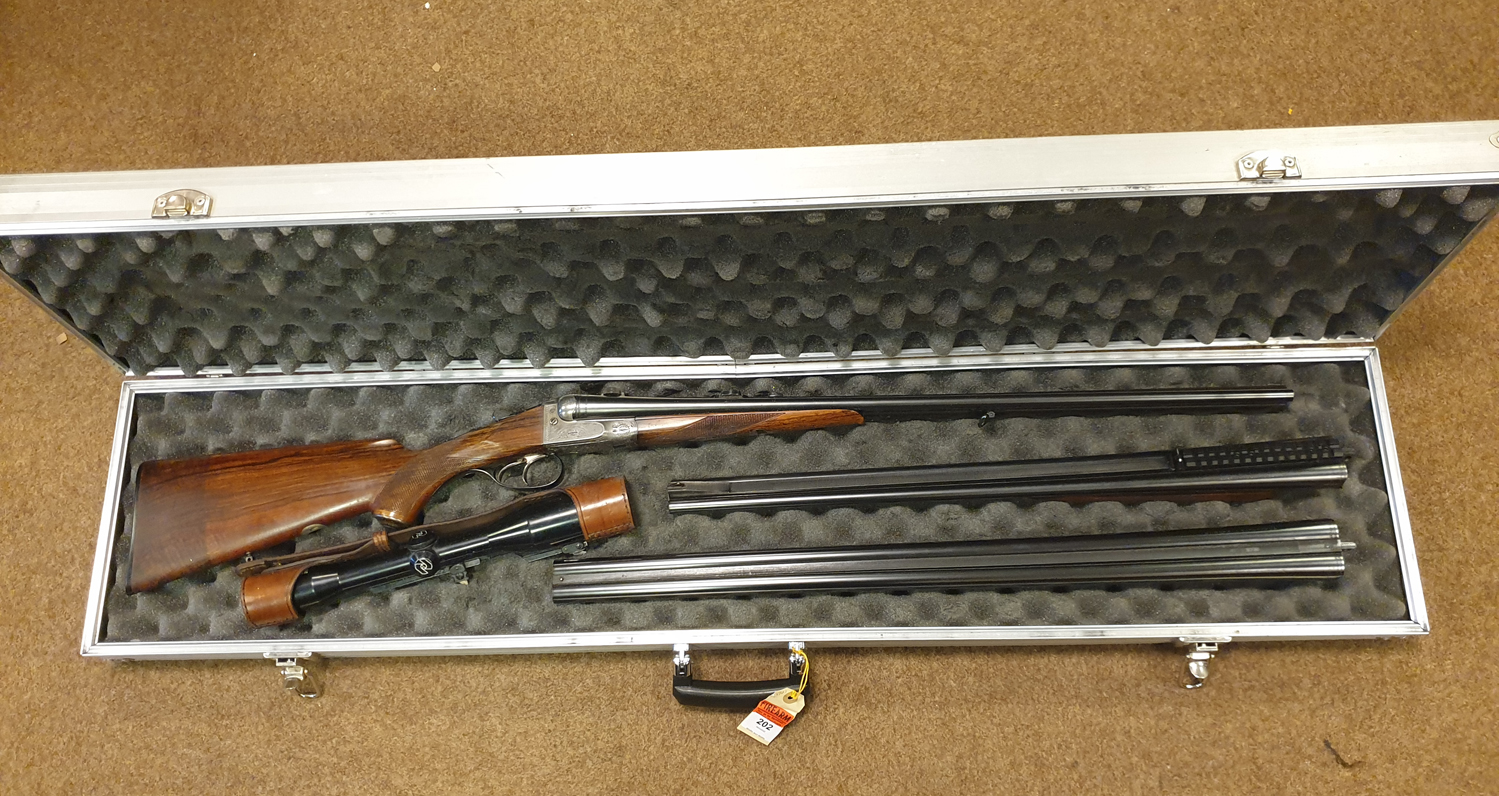 **A good double barrelled side by side 12 bore/8x57mm top lever hammerless boxlock non ejector