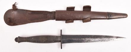 A Third pattern FS fighting knife, with lightly blued blade, steel crossguard, and grey metal