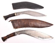 A kukri, horn hilt with WM mounts, in its leather covered sheath (split); and another kukri, with