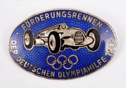A scarce Third Reich motoring badge, blue enamel oval 2¼" WM picture of racing car and "