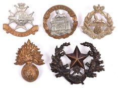 Five Vic or early Infantry cap badges: Royal Fusiliers, blackened brass Cameronians, East