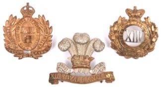 Three Cavalry cap badges: pre 1903 12th Lancers, Vic 13th Hussars, and 1904-06 pattern 18th Hussars.