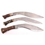 A kukri with brass mounted horn hilt; and 2 other kukris with rivetted wood grips. GC (no