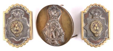 A pair of Victorian officer's stirrup slides of the Kings Dragoon Guards, and a similar martingale