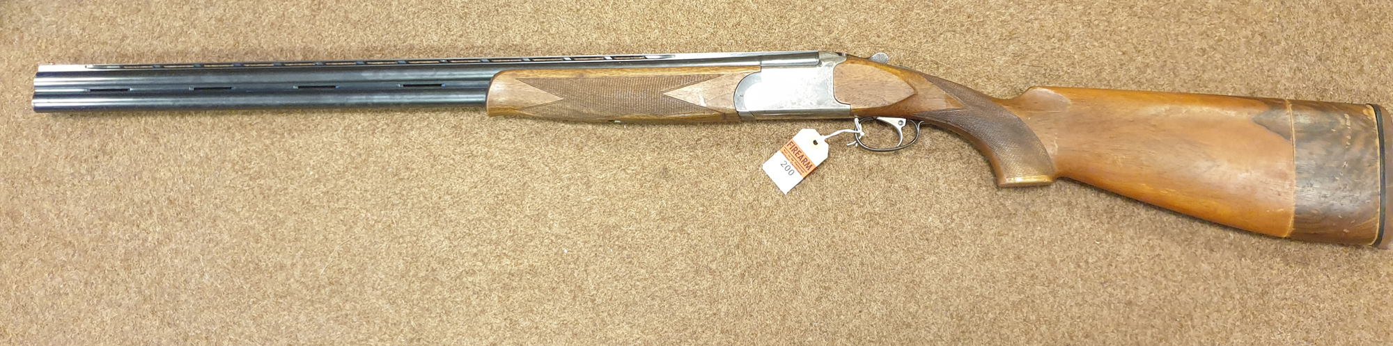 *An Italian DB O&U single trigger White Diamond 12 bore shotgun, number 30923, 50½" overall