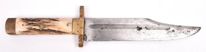 A Bowie knife, heavy clipped back blade 8¾", the hilt having heavy brass cross guard and pommel