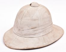 A WWII Wolseley helmet, originally khaki, it now has been white blanco coated; lining marked "