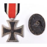 A Third Reich Iron Cross 2nd class, with ribbon; also a wound badge (blackened) above average GC. (