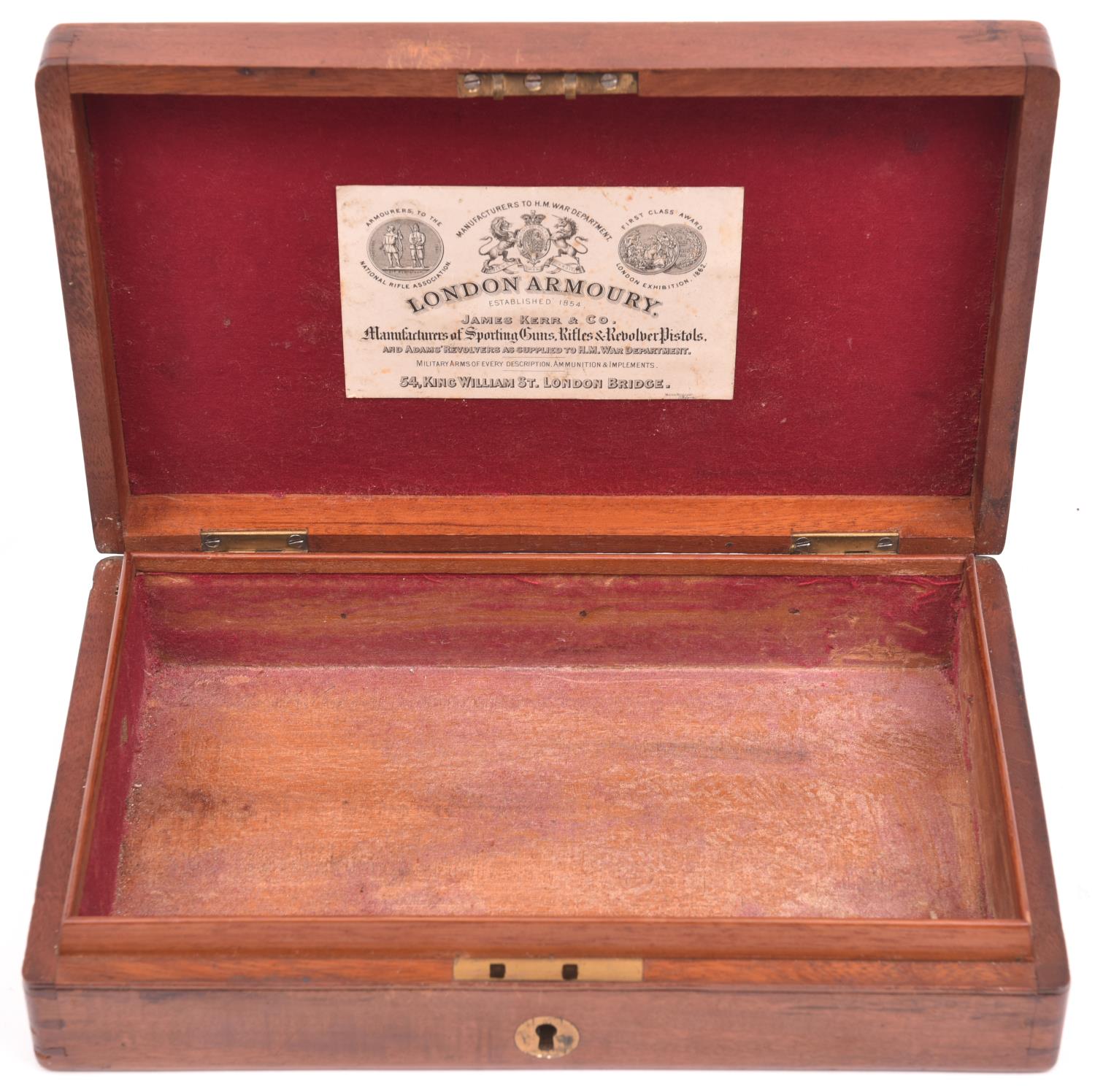 A mahogany case for a percussion revolver, 9¼" x 5¾" x 1¾" internal, with circular brass lid and