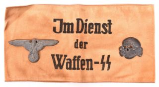 A Third Reich "Im Dienst Der Waffen SS" armband, also an alloy cap eagle and skull. GC £50-60
