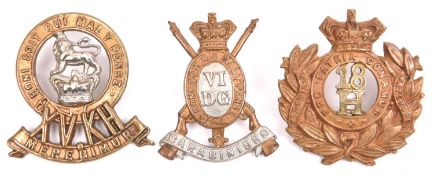 Three Victorian Cavalry cap badges: 6th Dragoon Guards, 15th Hussars and 18th Hussars. GC £60-70