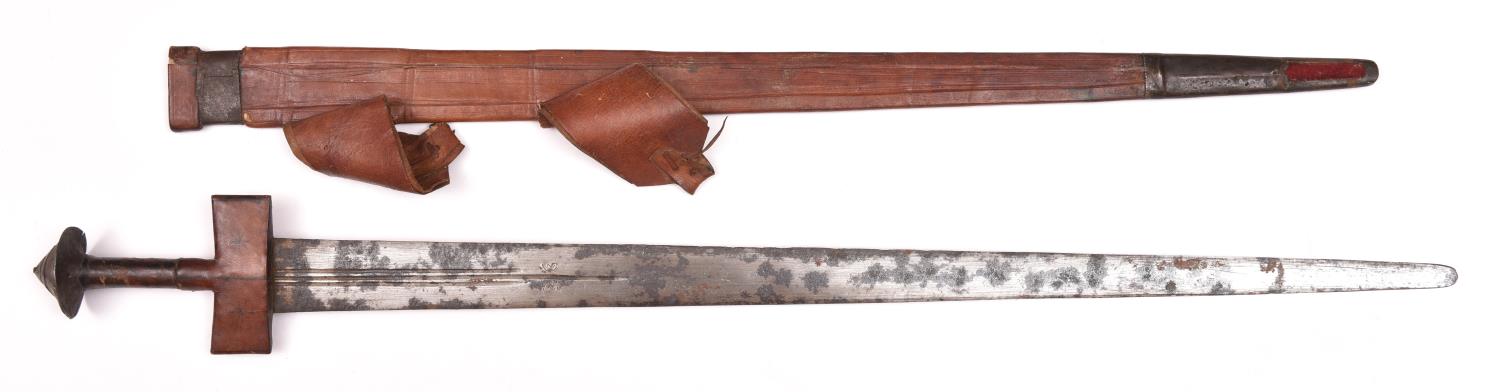 A Tuareg sword, tapered DE blade 31" with three short narrow fullers and crude double crescent