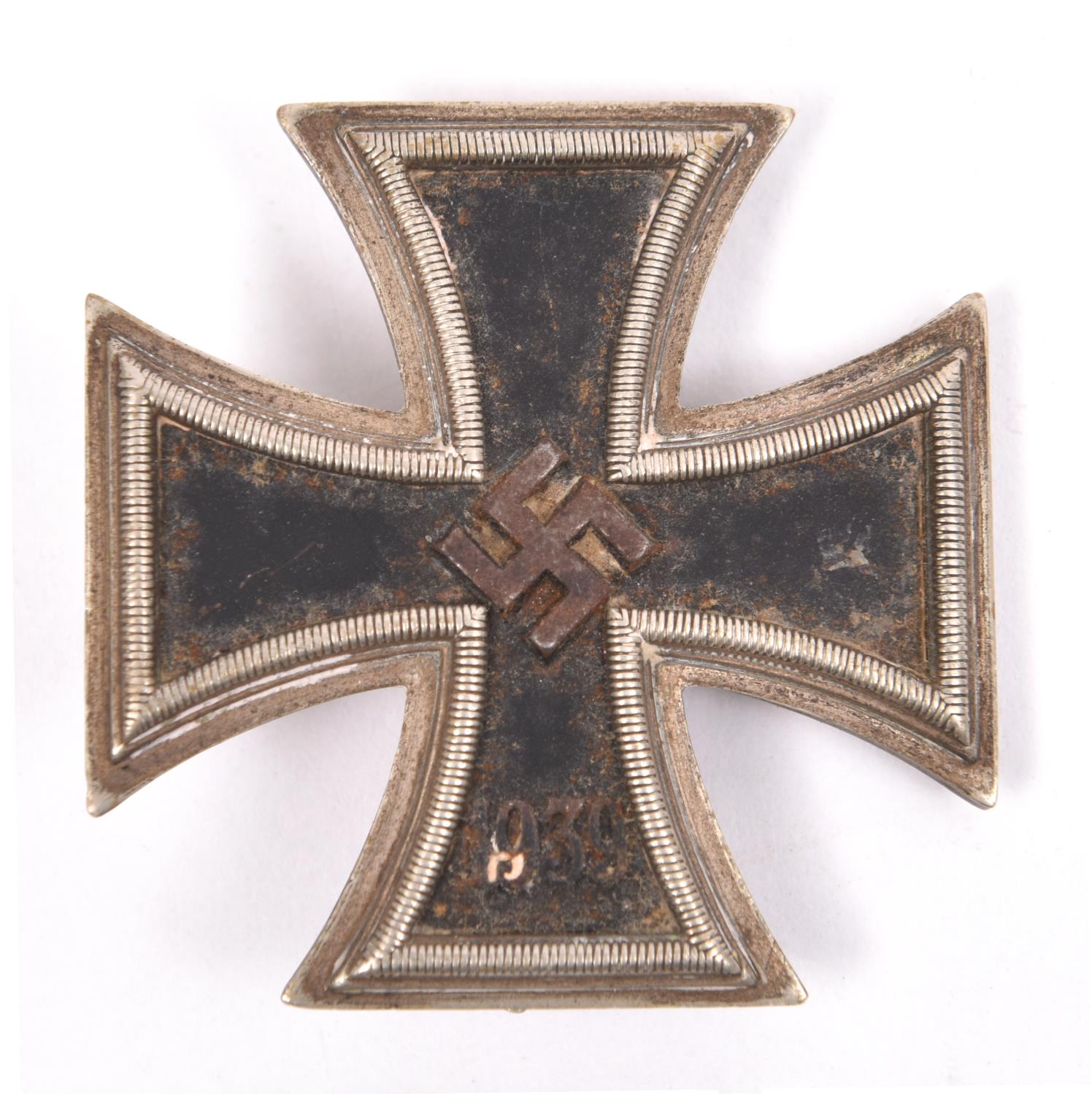 A 1939 Iron Cross 1st class, the back of the pin stamped "20", GC (requires cleaning). £50-60
