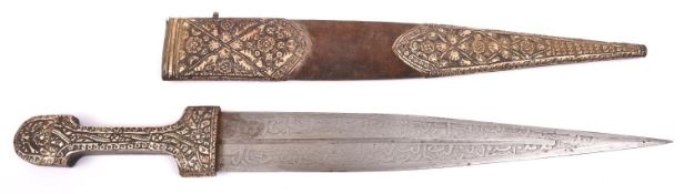 A Caucasian kindjal, heavily etched blade 14", embossed WM covered hilt, in its sheath covered in