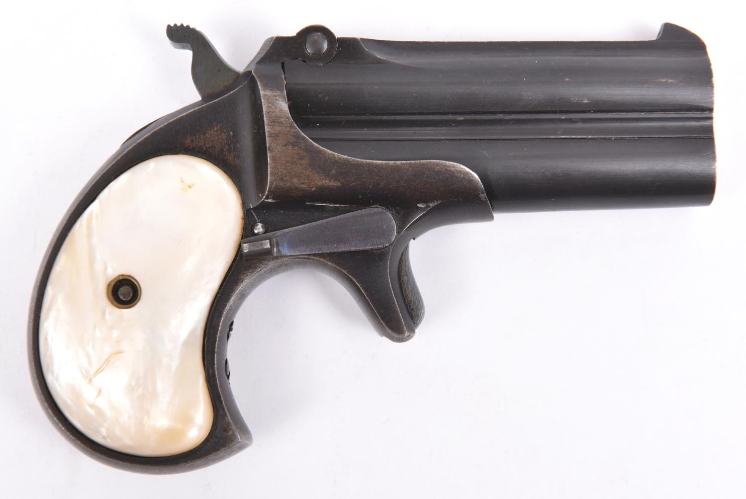 A .38" RF double barrelled over and under derringer pistol, number 773, blued overall with mother of
