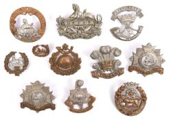 Eight early lugged Infantry cap badges: Somerset LI, Bedfordshire (2), South Wales Borderers (