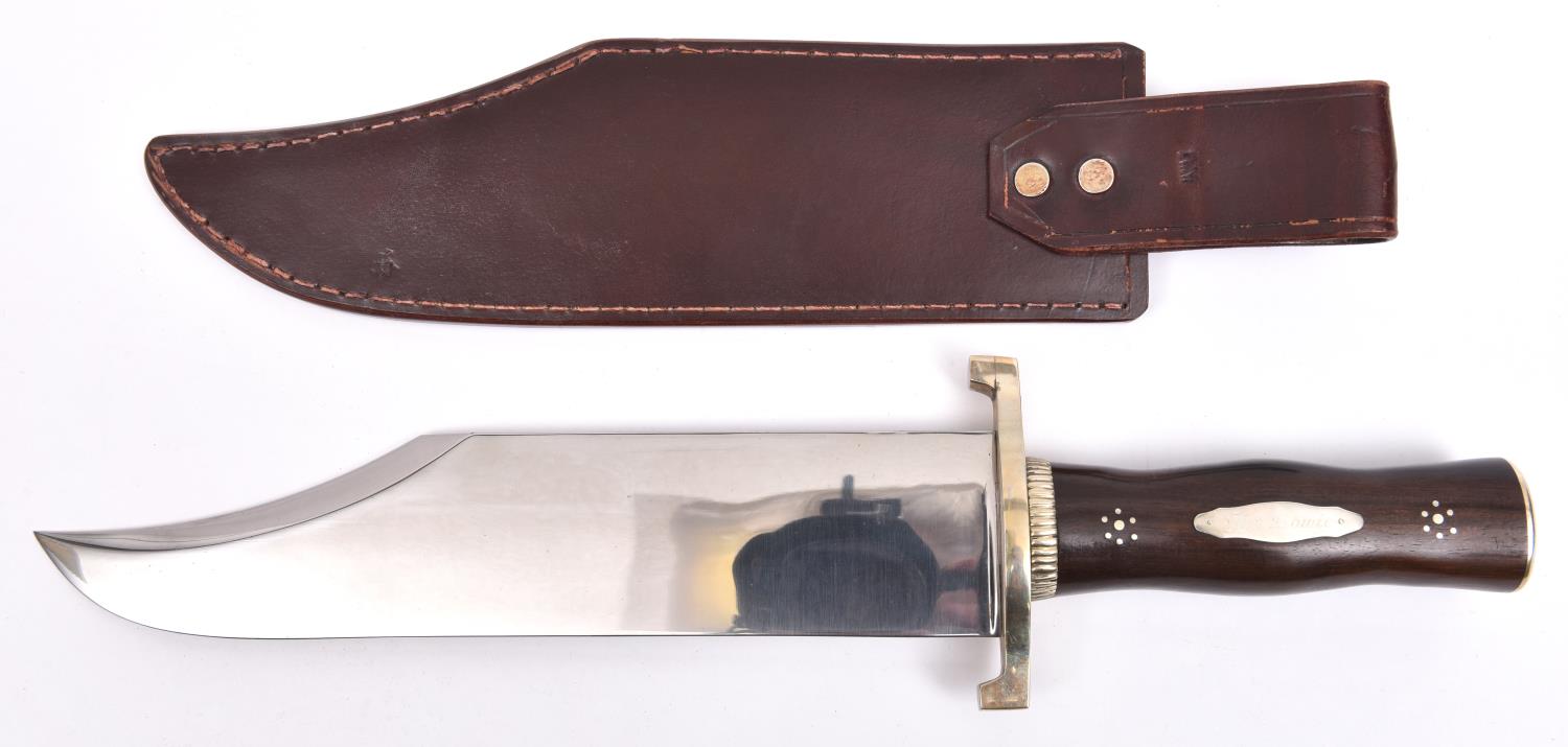 A large Bowie knife, broad flat clipped back blade 11", the hilt having pale brass mounts comprising - Image 2 of 2