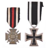 A 1914 Iron Cross 2nd class, the ring stamped with number code, (illegible), and a 1914-18 Honour