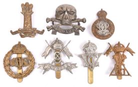 Seven Cavalry cap badges: Bays, 5th Inniskilling Dgn Guards, 7th Hussars, 9th Lancers, 11th Hussars,