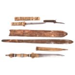 A short Masai type sime; a Japanese bone dagger; a military jack knife and an Arab dagger in a brass