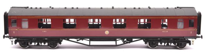 A Gauge One Tenmille Products kit built LMS Full First corridor coach, 1039, in lined maroon livery.