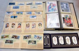 A quantity of cigarette cards and postcards. Including 8x cigarette card booklets including;