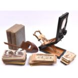 A Stereoscopic Viewer and quantity of cards. Ebonised viewer with stereo and mono lenses,