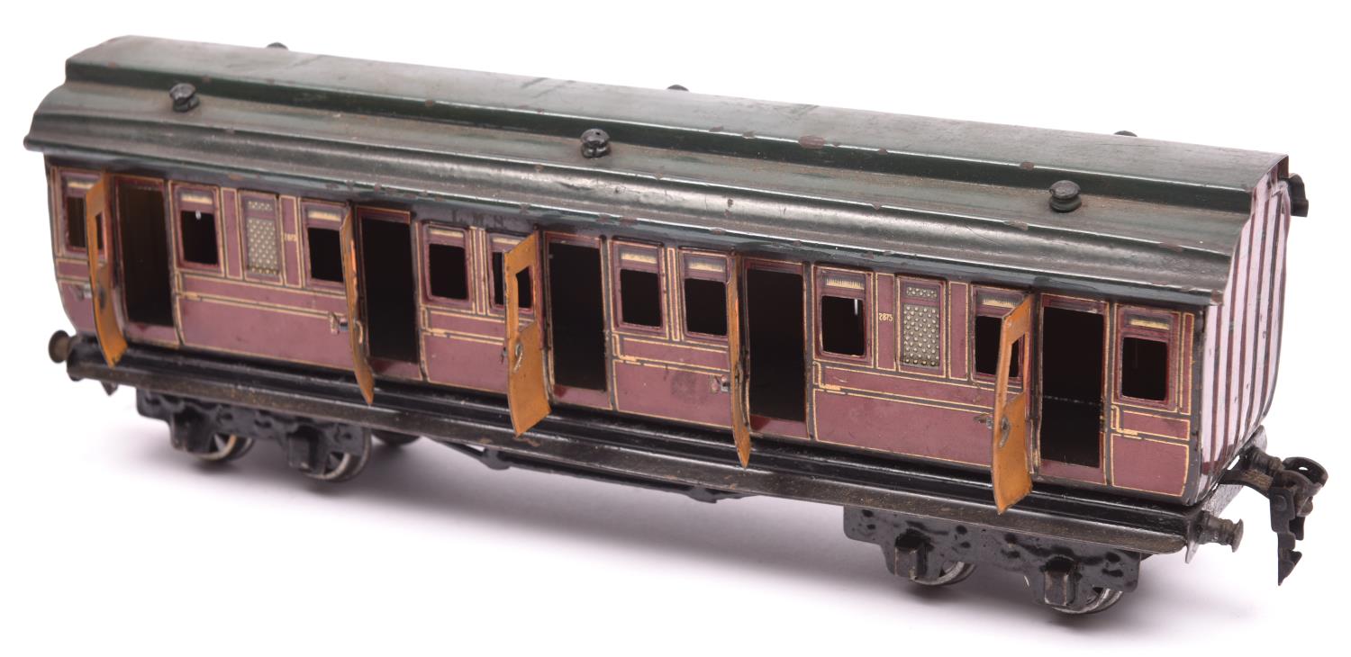 A Marklin O gauge tinplate Midland Railway bogie coach. Composite First Third coach in lined