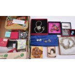 A quantity of boxed items of jewelry, including several silver items. Mostly pairs of earrings by