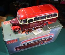 A Sun Star 1:24 scale Bedford OB Coach. In maroon and red Hants & Sussex livery. Boxed with