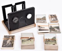 A pocket Stereoscopic viewer. Folding tinplate stereo viewer together with a small section of paired