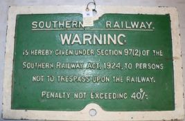 A Southern Railway cast iron sign. Warning is Hereby Given not to Trespass on the Railway. Painted