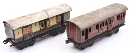 2x Bing O gauge tinplate bogie coaches. An LMS First Third Composite coach in lined maroon livery