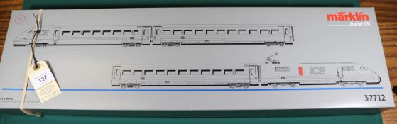 A Marklin digital HO gauge 4-car DB ICE electric multiple unit set (37712). In grey and red