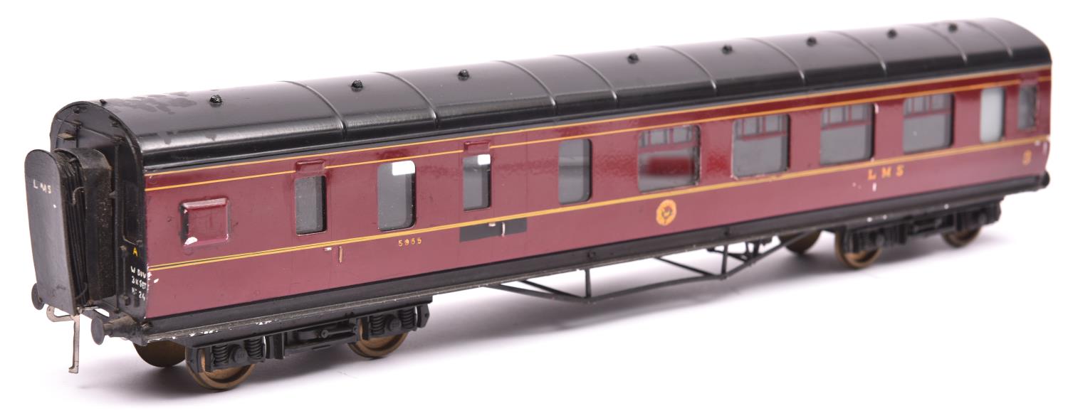 An Exley O gauge LMS corridor coach. Brake Third in maroon livery. QGC-GC, chipping and minor over-