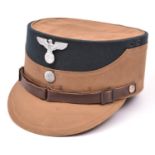 A Third Reich SA man's brown kepi, green cloth crown with alloy eagle and buttons, brown leather