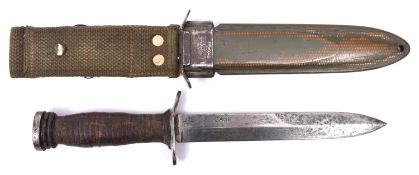 An American WWII M3 fighting knife by Case, in its M8 sheath by B.M. Co. Basically GC (the knife