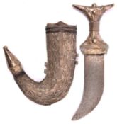 An Arab child's jambiya, flat blade 4", the hilt and sheath of white metal with filigree