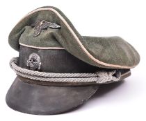A copy of a Third Reich SS officer's cap, with metal skull and eagle, silver bullion cords and fibre
