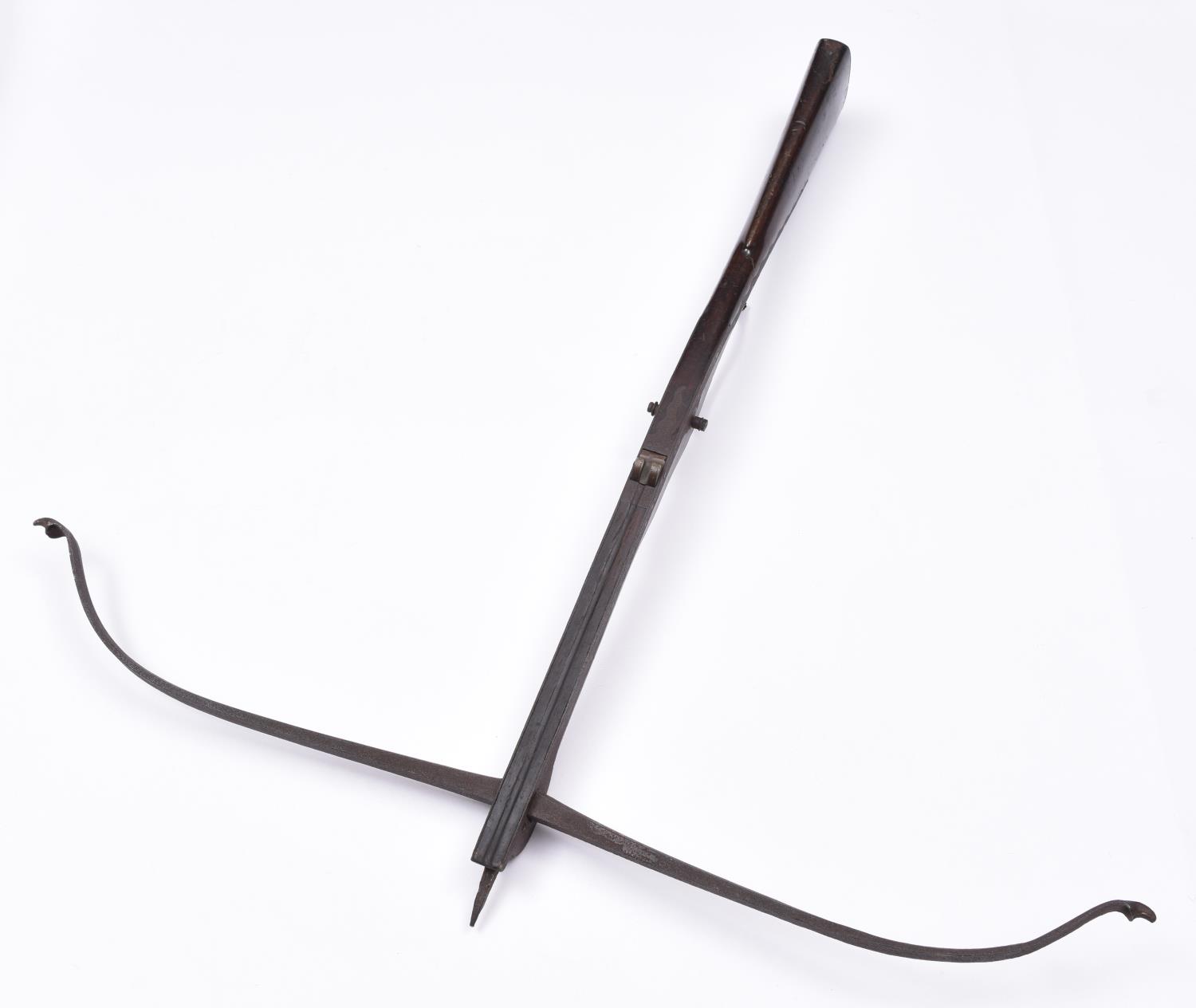 A mid 18th century crossbow, steel span 36", dark walnut stock 35" with wavy steel sideplates,