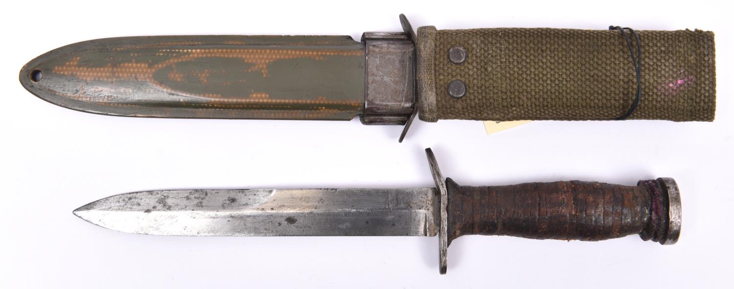 An American WWII M3 fighting knife by Case, in its M8 sheath by B.M. Co. Basically GC (the knife - Image 2 of 2