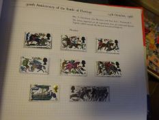 12x Stamp Albums. Containing a variety of mainly British postage stamps, with some world stamps.