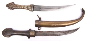A Moroccan jambiya, blade 9", with brass mounted plain wood hilt in its brass sheath with chased