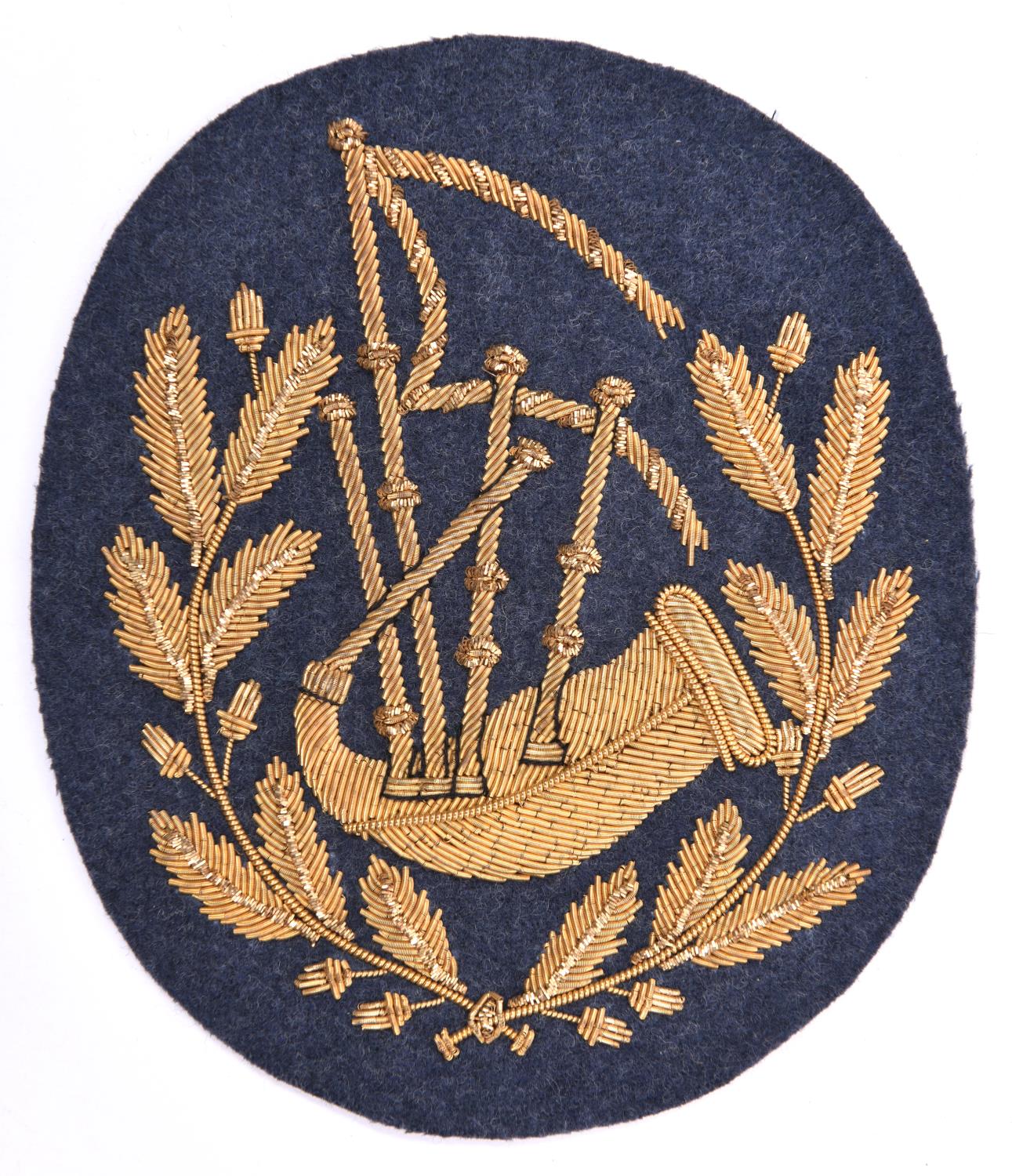 A scarce RAF pipers arm badge, gilt bullion on RAF grey cloth. VGC £70-100