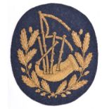 A scarce RAF pipers arm badge, gilt bullion on RAF grey cloth. VGC £70-100
